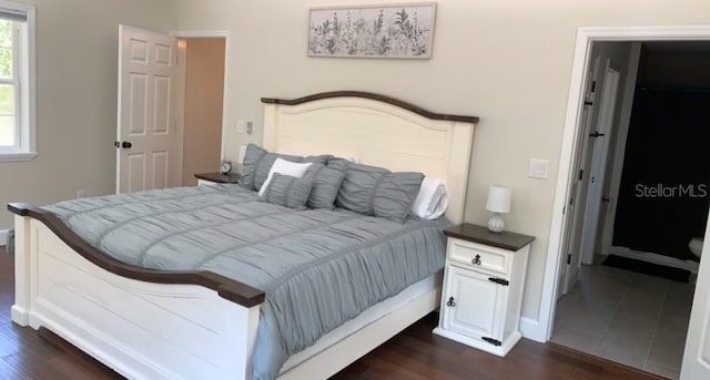 7152 Sandy Ln, Wesley Chapel, FL 33544 - bedroom featuring dark wood-style floors and baseboards