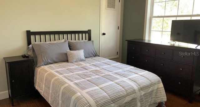 7152 Sandy Ln, Wesley Chapel, FL 33544 - bedroom featuring dark wood finished floors