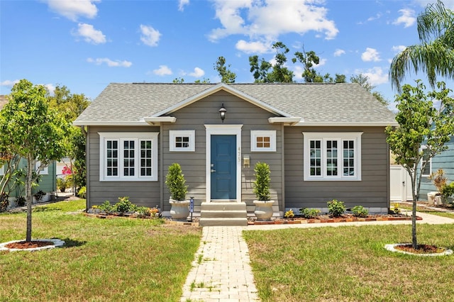 475 28th Ave N, Saint Petersburg, FL 33704 - bungalow with a front lawn and a shingled roof