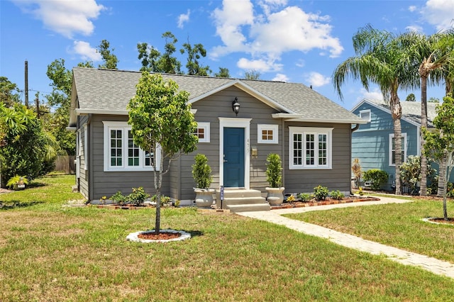 475 28th Ave N, Saint Petersburg, FL 33704 - bungalow with a front yard and a shingled roof