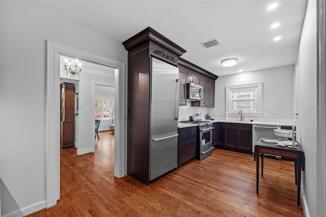 475 28th Ave N, Saint Petersburg, FL 33704 - kitchen with high quality appliances, light countertops, wood finished floors, recessed lighting, and baseboards