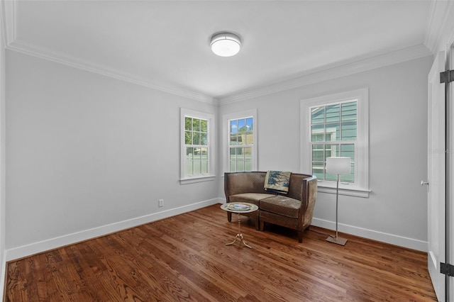 475 28th Ave N, Saint Petersburg, FL 33704 - living area with ornamental molding, plenty of natural light, baseboards, and wood finished floors