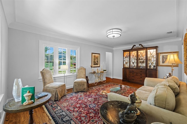 475 28th Ave N, Saint Petersburg, FL 33704 - living room featuring wood finished floors, baseboards, and crown molding