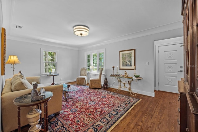 475 28th Ave N, Saint Petersburg, FL 33704 - living area featuring crown molding, wood finished floors, and baseboards