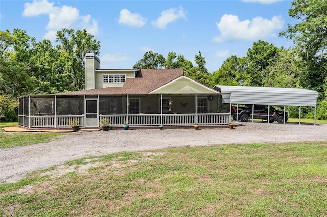 1611 County Road 753s, Webster, FL 33597 - rear view of house with dirt driveway, a yard, a sunroom, and a chimney