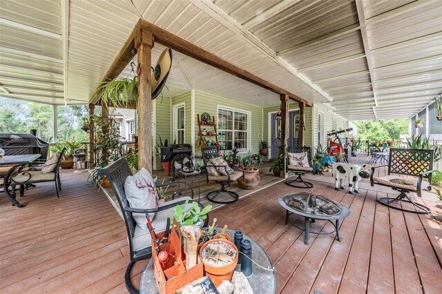 1611 County Road 753s, Webster, FL 33597 - wooden deck with a fire pit, outdoor dining space, and a grill