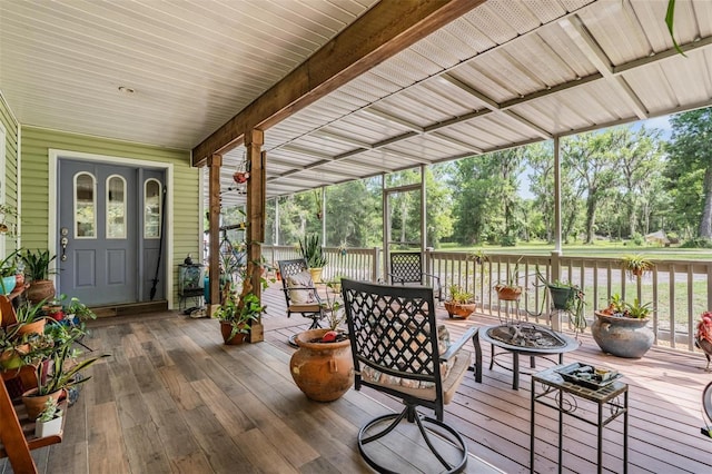 1611 County Road 753s, Webster, FL 33597 - wooden terrace featuring a fire pit and view of wooded area