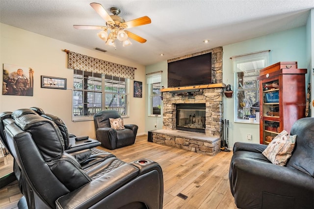 1611 County Road 753s, Webster, FL 33597 - living room featuring wood-type flooring, ceiling fan, and a fireplace