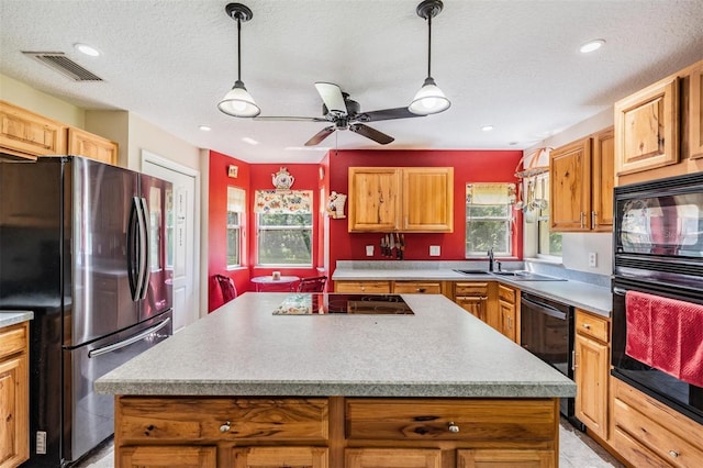 1611 County Road 753s, Webster, FL 33597 - kitchen featuring black appliances, a center island, pendant lighting, a sink, and recessed lighting