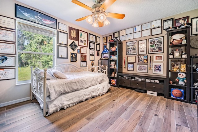 1611 County Road 753s, Webster, FL 33597 - bedroom with wood finished floors, baseboards, and ceiling fan