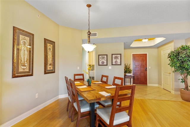521 Mandalay Ave Unit 307, Clearwater Beach, FL 33767 - dining space with light wood finished floors and baseboards