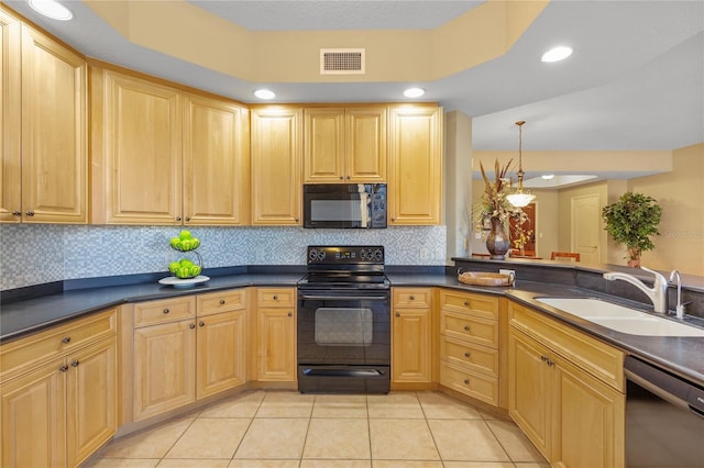 521 Mandalay Ave Unit 307, Clearwater Beach, FL 33767 - kitchen with black appliances, a sink, dark countertops, light brown cabinetry, and recessed lighting
