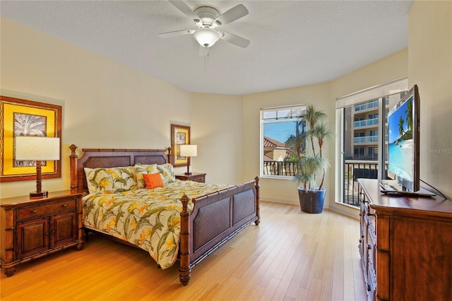 521 Mandalay Ave Unit 307, Clearwater Beach, FL 33767 - bedroom featuring light wood finished floors, baseboards, a ceiling fan, and access to exterior