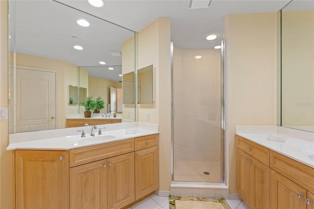 521 Mandalay Ave Unit 307, Clearwater Beach, FL 33767 - full bathroom featuring a stall shower, two vanities, tile patterned floors, and recessed lighting