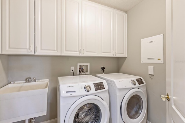 521 Mandalay Ave Unit 307, Clearwater Beach, FL 33767 - washroom featuring cabinet space and washing machine and dryer