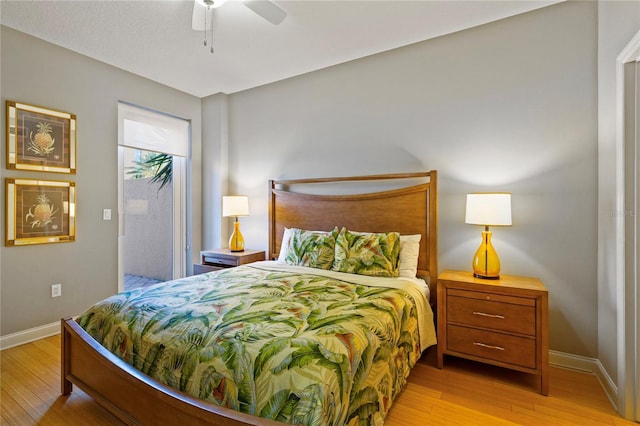 521 Mandalay Ave Unit 307, Clearwater Beach, FL 33767 - bedroom with light wood-style floors, baseboards, ceiling fan, and access to exterior
