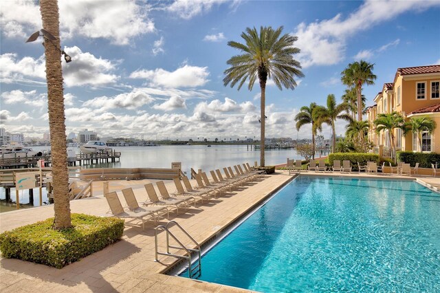 521 Mandalay Ave Unit 307, Clearwater Beach, FL 33767 - community pool with a water view and a patio area