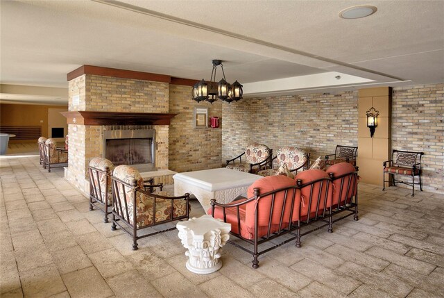 521 Mandalay Ave Unit 307, Clearwater Beach, FL 33767 - view of patio featuring an outdoor living space with a fireplace