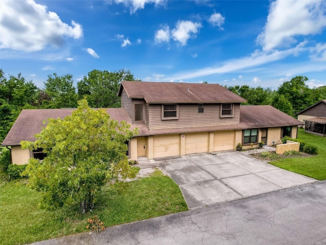 507 E Curlew Pl, Tarpon Springs, FL 34689 - view of front of house with a garage, driveway, a shingled roof, and a front lawn
