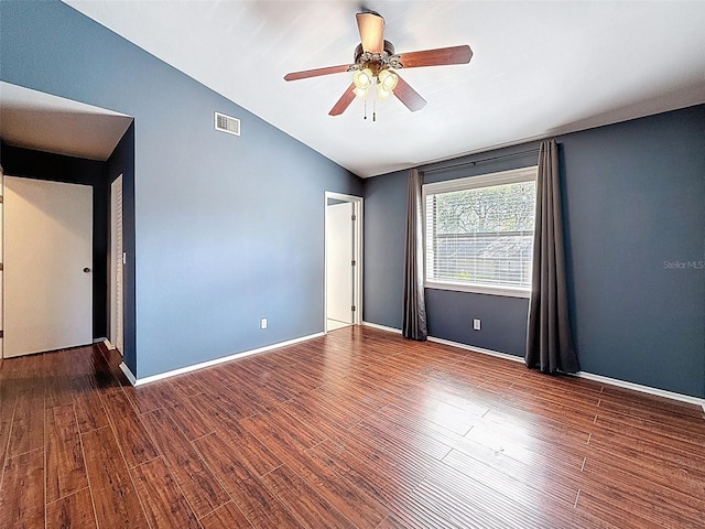 507 E Curlew Pl, Tarpon Springs, FL 34689 - unfurnished room featuring vaulted ceiling, ceiling fan, wood finished floors, and baseboards