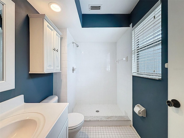 507 E Curlew Pl, Tarpon Springs, FL 34689 - bathroom featuring toilet, vanity, tile patterned flooring, and tiled shower