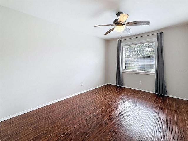 507 E Curlew Pl, Tarpon Springs, FL 34689 - spare room with wood finished floors, a ceiling fan, and baseboards