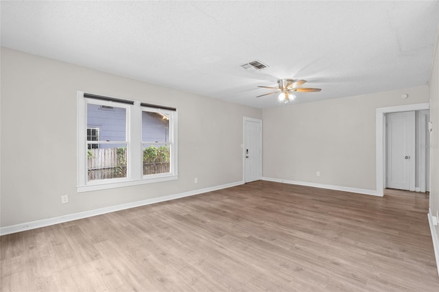 6489 30th St N, Saint Petersburg, FL 33702 - spare room with a ceiling fan, light wood finished floors, and baseboards