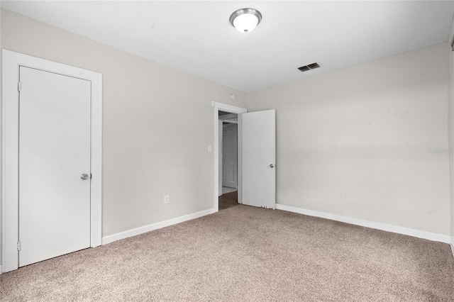 6489 30th St N, Saint Petersburg, FL 33702 - unfurnished bedroom featuring carpet floors and baseboards