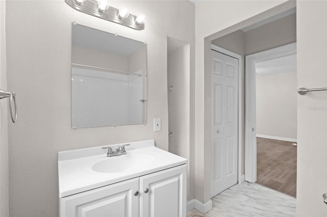 6489 30th St N, Saint Petersburg, FL 33702 - full bathroom featuring vanity, marble finish flooring, and a shower