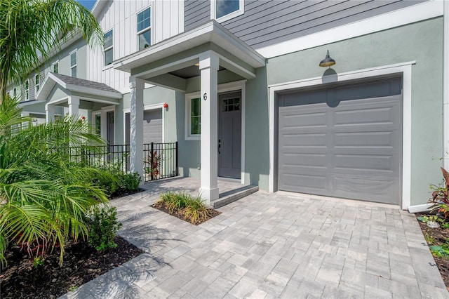 5530 N 9th St Unit 6, Tampa, FL 33604 - property entrance featuring stucco siding and decorative driveway