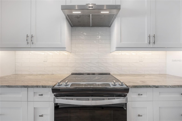 5530 N 9th St Unit 6, Tampa, FL 33604 - kitchen with range hood, electric range, backsplash, and white cabinets