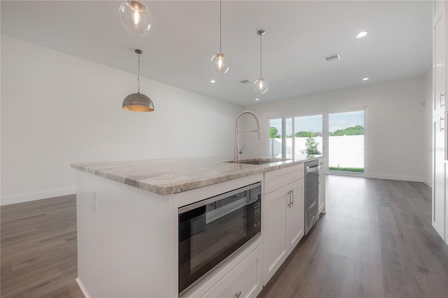 5530 N 9th St Unit 6, Tampa, FL 33604 - kitchen featuring built in microwave, a sink, dark wood-style flooring, baseboards, and recessed lighting