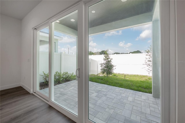 5530 N 9th St Unit 6, Tampa, FL 33604 - doorway with recessed lighting, baseboards, and wood finished floors