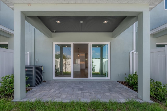5530 N 9th St Unit 6, Tampa, FL 33604 - view of exterior entry with stucco siding and cooling unit