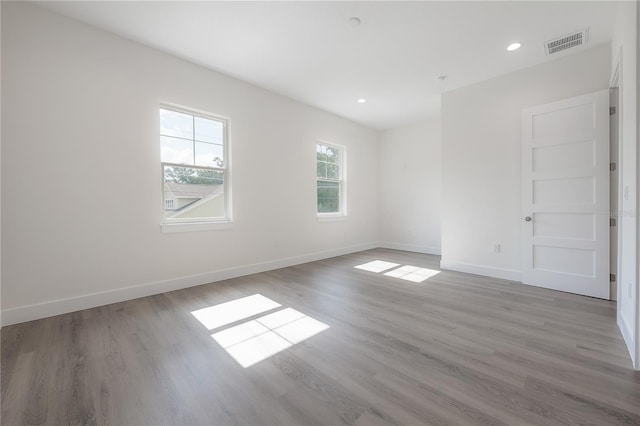5530 N 9th St Unit 6, Tampa, FL 33604 - spare room with wood finished floors, baseboards, and recessed lighting