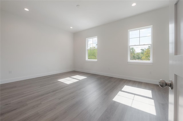 5530 N 9th St Unit 6, Tampa, FL 33604 - unfurnished room featuring baseboards, wood finished floors, and recessed lighting