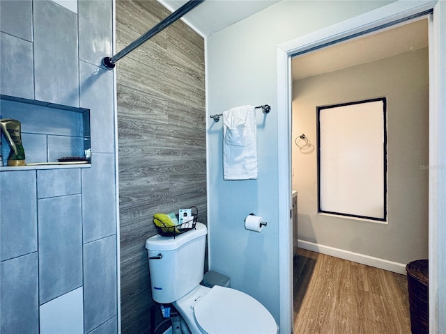 4360 Outrigger Ln, Tampa, FL 33615 - bathroom featuring toilet, wood finished floors, and baseboards