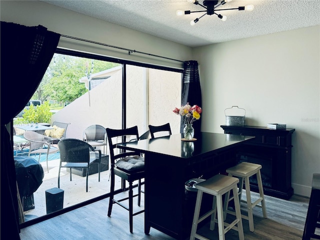 4360 Outrigger Ln, Tampa, FL 33615 - dining space featuring wood finished floors and a textured ceiling