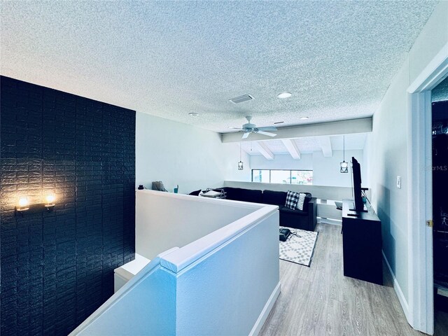 4360 Outrigger Ln, Tampa, FL 33615 - interior space with wood finished floors, a textured ceiling, and ceiling fan