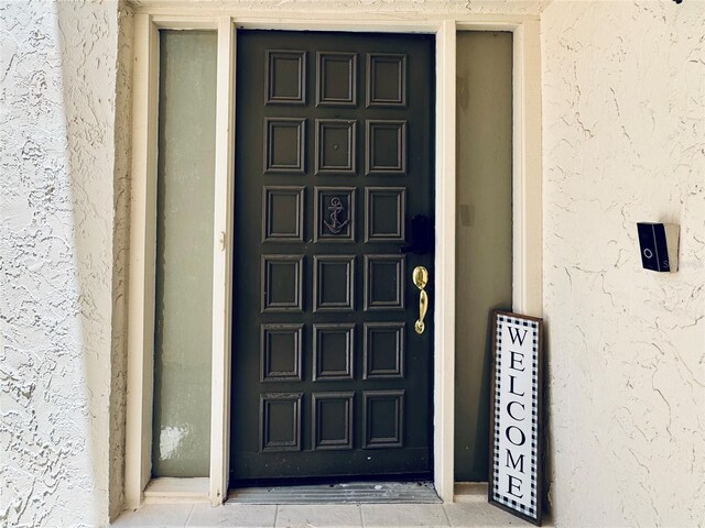 4360 Outrigger Ln, Tampa, FL 33615 - doorway to property with stucco siding