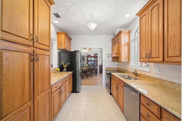 8708 Laurel Dr N, Pinellas Park, FL 33782 - kitchen with appliances with stainless steel finishes, a sink, ceiling fan, light stone countertops, and recessed lighting