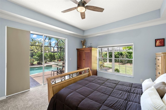 8708 Laurel Dr N, Pinellas Park, FL 33782 - bedroom featuring access to outside, carpet flooring, ceiling fan, and a raised ceiling