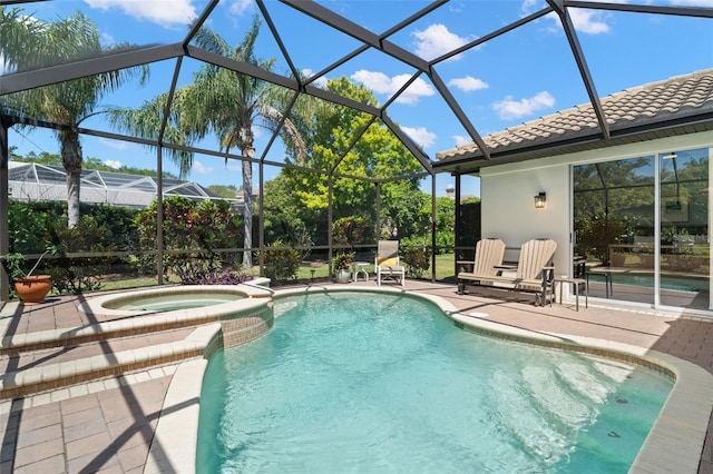 8708 Laurel Dr N, Pinellas Park, FL 33782 - view of pool featuring a patio, a lanai, and a pool with connected hot tub