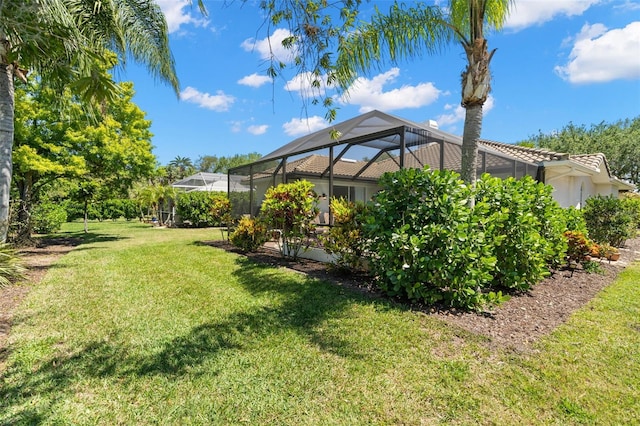 8708 Laurel Dr N, Pinellas Park, FL 33782 - view of green lawn with a lanai
