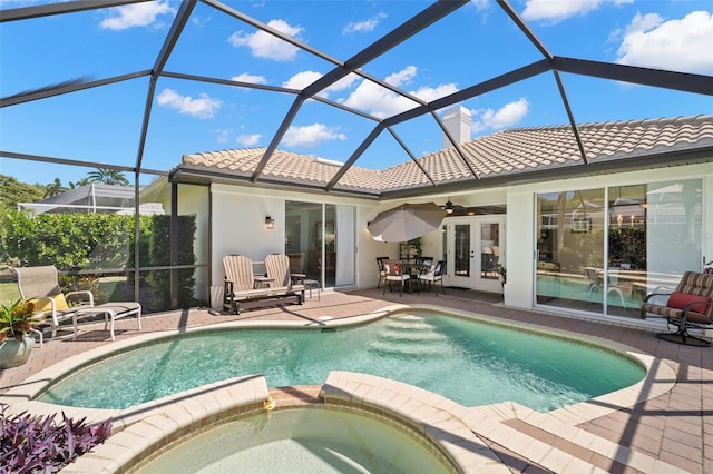 8708 Laurel Dr N, Pinellas Park, FL 33782 - view of swimming pool featuring french doors, a patio area, a pool with connected hot tub, ceiling fan, and a lanai
