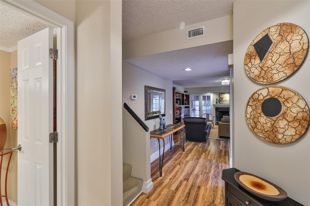 3053 S Concordia Ave Unit A, Tampa, FL 33629 - hallway with a textured ceiling and light wood finished floors