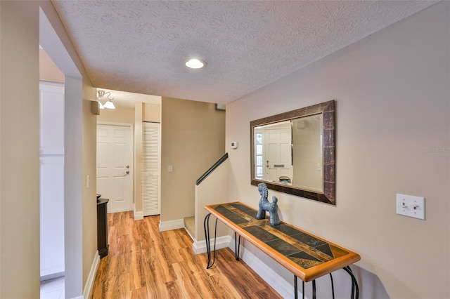 3053 S Concordia Ave Unit A, Tampa, FL 33629 - hall featuring a textured ceiling, light wood finished floors, baseboards, and recessed lighting