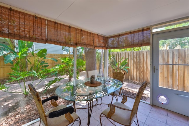 3053 S Concordia Ave Unit A, Tampa, FL 33629 - sunroom featuring outdoor dining space and tile patterned floors