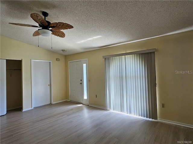 870 S Thyme Pt, Homosassa, FL 34448 - entrance foyer with wood finished floors, ceiling fan, a textured ceiling, and baseboards