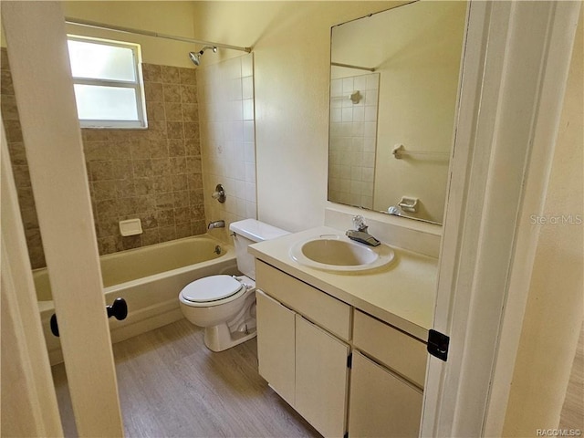 870 S Thyme Pt, Homosassa, FL 34448 - bathroom featuring  shower combination, wood finished floors, toilet, and vanity